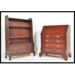 An antique style mahogany bureau desk having an appointed interior together with a Stag mahogany '