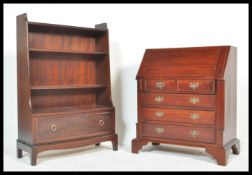 An antique style mahogany bureau desk having an appointed interior together with a Stag mahogany '