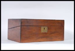 A 19th Century Victorian walnut veneer writing slope opening to reveal a red velvet inset,  two
