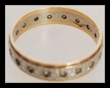 A hallmarked 9ct gold full eternity ring with with white stones. Hallmarked London. Total weight 2.