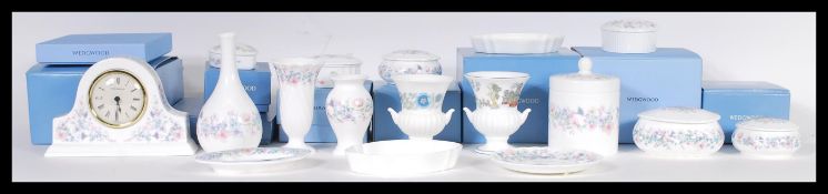 A collection of mostly boxed Wedgwood ceramics in the Angela pattern to include various vases,