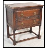 An Edwardian oak Jacobean revival chest of drawers