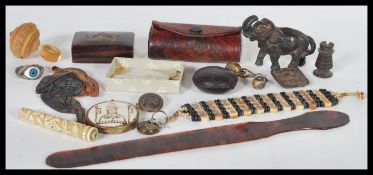 A good collection of mixed items dating from the 19th Century to include a Tibetan pendant, bone and