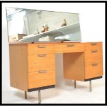 A vintage retro 20th century Stag twin pedestal kneehole dressing table having a twin bank of 3