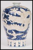 A large 20th Century Chinese Meiping shape plum vase having blue decoration of dragons with six blue