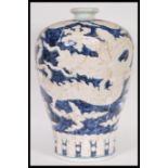 A large 20th Century Chinese Meiping shape plum vase having blue decoration of dragons with six blue