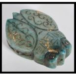 An unusual Chinese soapstone green jade type bid double sided toggle pendant in the form of a