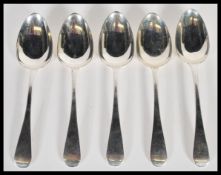 A set of four 19th Century William IV  hallmarked silver dessert spoons in the Old English Pattern