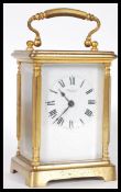 A 19th Century Victorian gilt brass cased carriage clock by Russell Ltd of Liverpool. The white