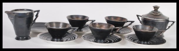 A early 20th century Art Deco sterling silver on porcelain coffee set / service consisting of five