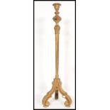 An early 20th Century Edwardian standard lamp raised on scrolled leg with gilt acanthus leaf