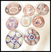 A collection of early 20th Century Japanese Late Meiji period Imari chargers to include a larger