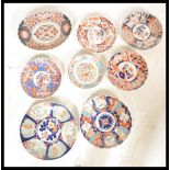 A collection of early 20th Century Japanese Late Meiji period Imari chargers to include a larger