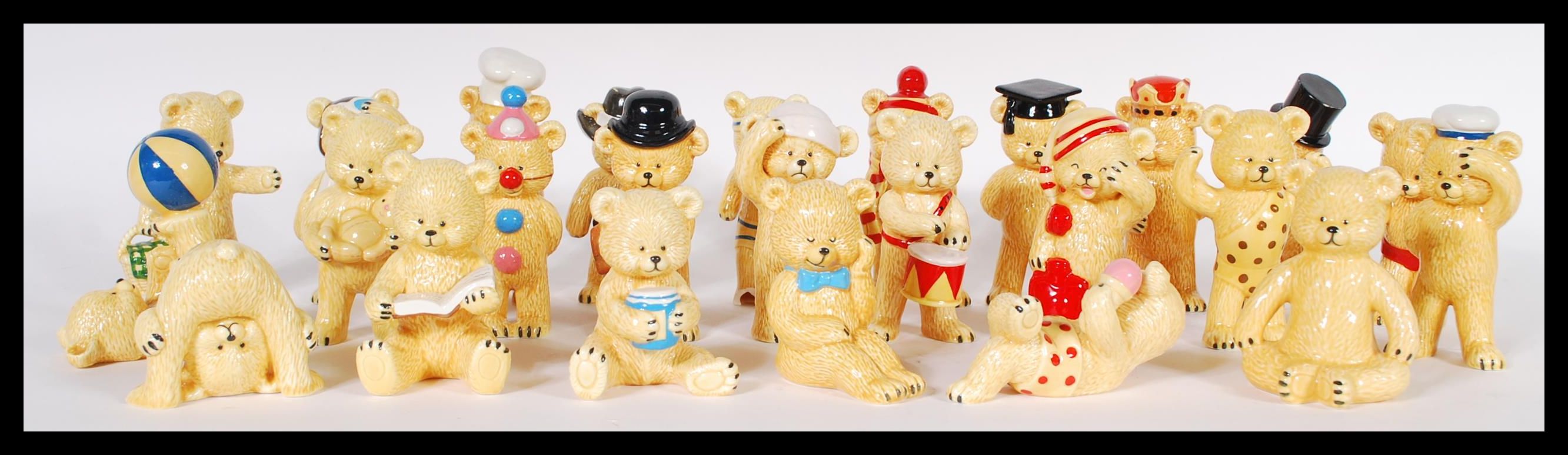 A collection of danbury mint ceramic bears, to include polar bear, diving bear, poor bear, yoga