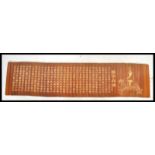 A 20th century Chinese bamboo scroll slip having panels of bamboo inscribed with Chinese