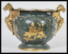 An unusual early 20th Century staffordshire ceramic planter / pot, twin handled in the form of two