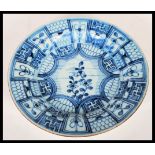 An 18th century Qing Dynasty blue and white glazed Chinese plate having a central starburst panel