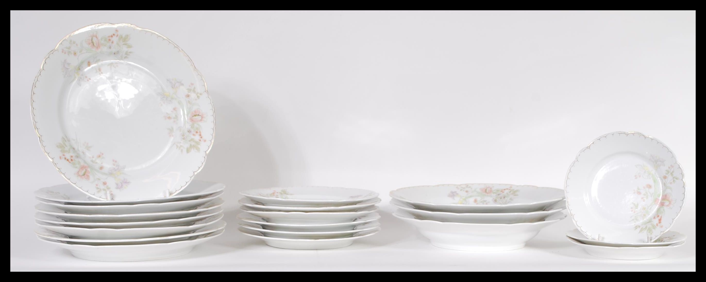 A 20th Century German porcelain dinner service having hand painted floral decoration consisting of