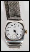 An early 20th Century Omega hallmarked silver watch having a white enamel face with bold numeral