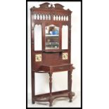 A 19th Century Victorian hall stand having a centr