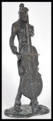 A 20th Century bronze sculpture statue depicting a musician playing a cello in suit raised on plinth