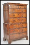 An 18th century George II walnut chest on chest of drawers / tallboy. The top comprising a flared