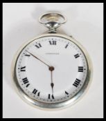 A mid 20th century silver white metal Longines pocket watch, having a white enameled face with roman