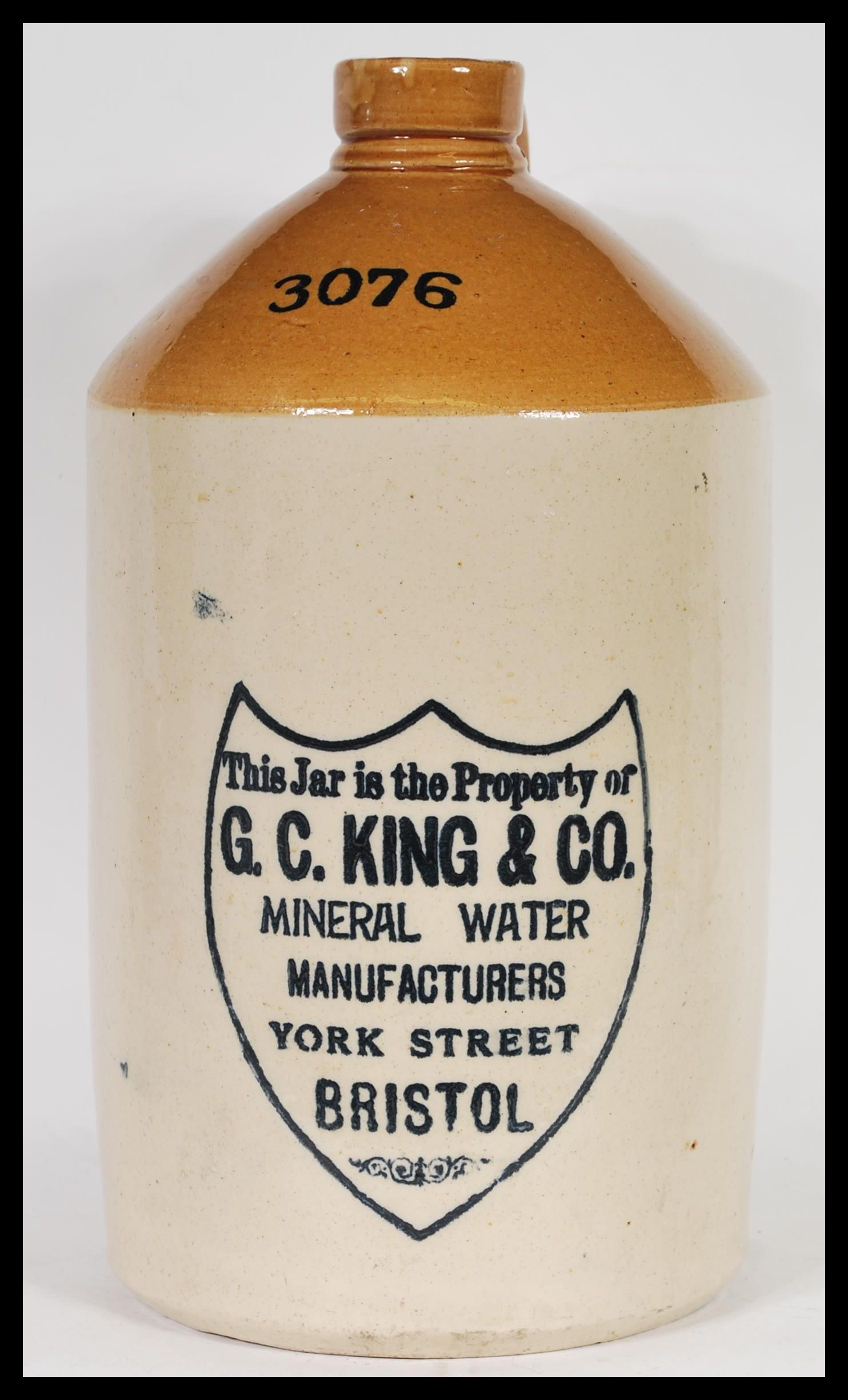 A large antique vintage stoneware flagon with notation to front for G. C. King & Co of Bristol.