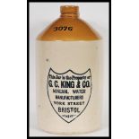 A large antique vintage stoneware flagon with notation to front for G. C. King & Co of Bristol.