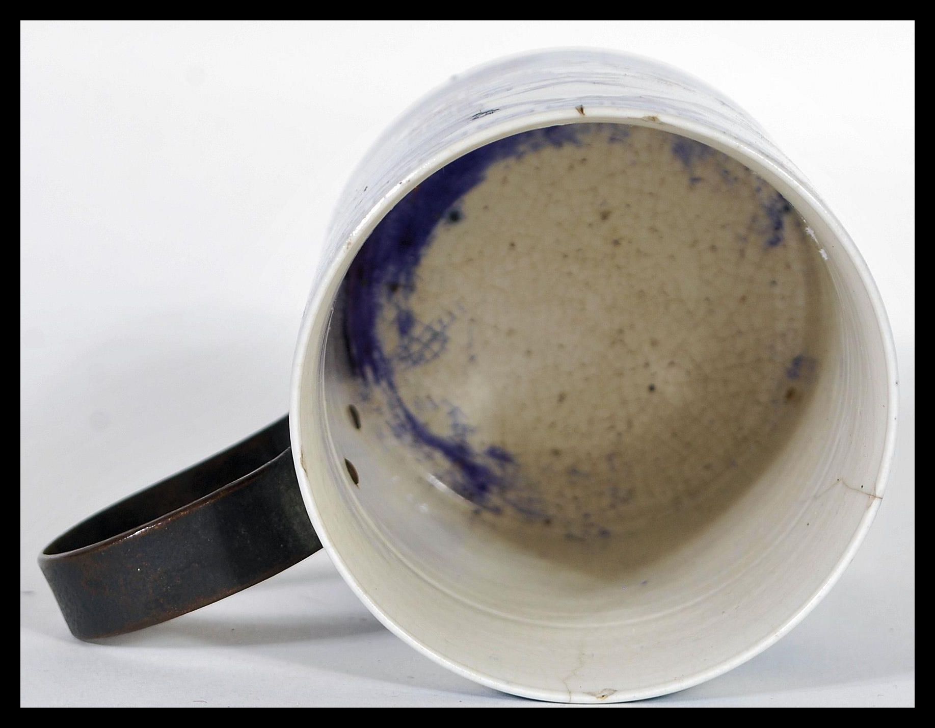 An 18th Century ceramic blue and white glazed brush pot having a later applied iron scroll handle, - Image 5 of 6