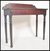 A 19th Century Regency rosewood console hall table raised on tapering turned legs with fitted frieze