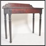 A 19th Century Regency rosewood console hall table raised on tapering turned legs with fitted frieze