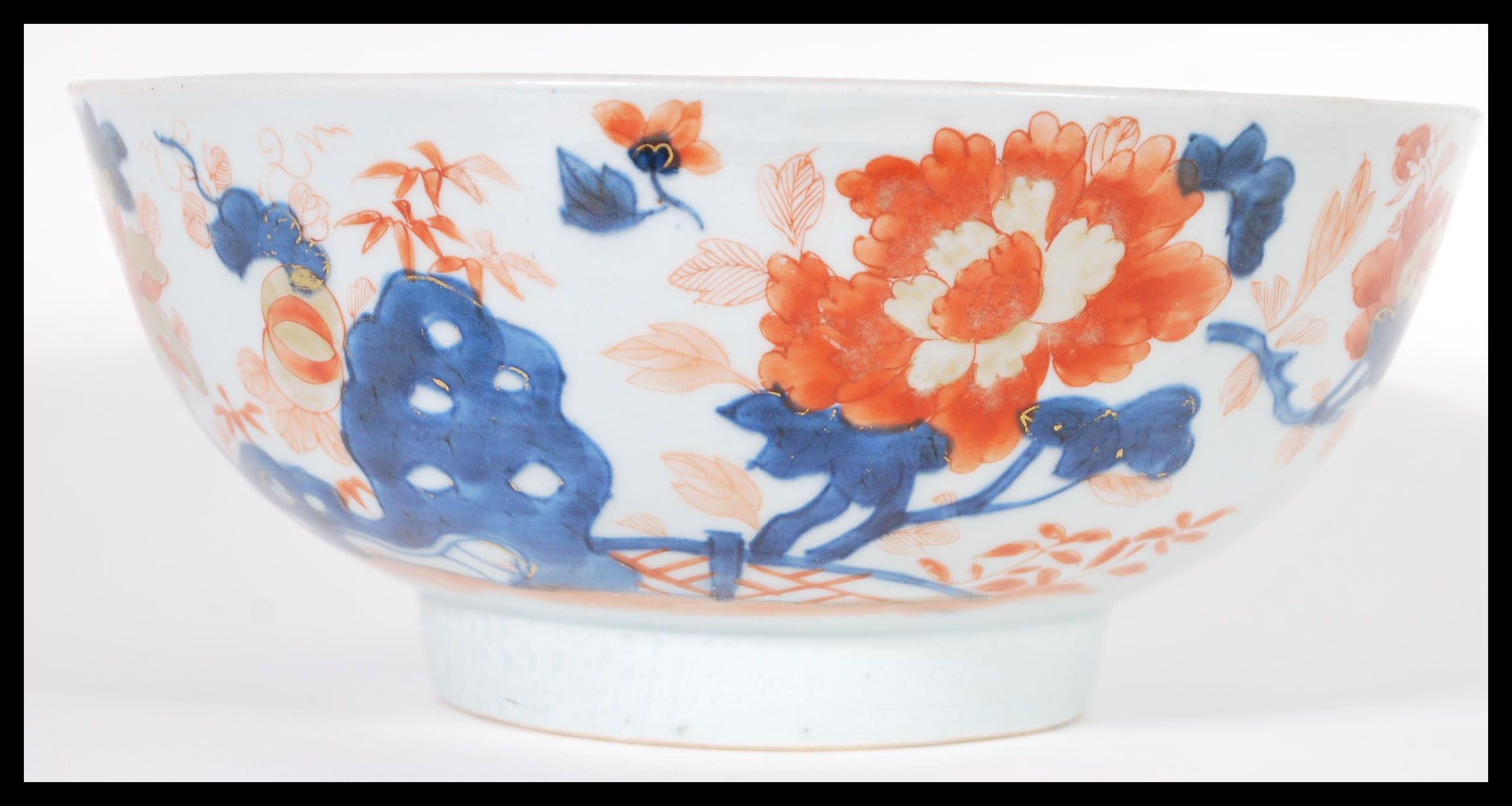 An 18th Century Chinese Imari pattern centerpiece bowl having hand gilded decoration with central