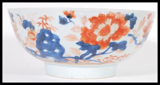 An 18th Century Chinese Imari pattern centerpiece bowl having hand gilded decoration with central