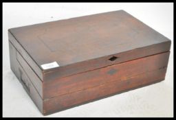 A early 19th century Georgian mahogany writing slope box. The inlaid hinged lid opening to reveal