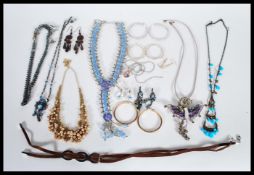 A selection of vintage costume jewellery items to include necklaces and earrings, a selection of