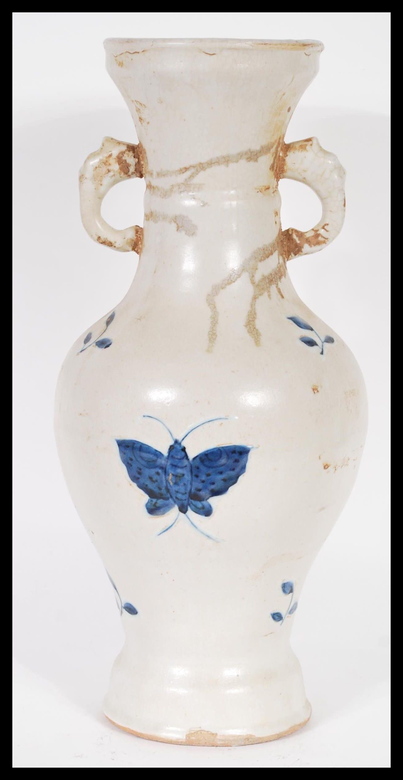 A 20th Century Chinese large vase having blue and white decoration of butterflies with twin elephant - Image 3 of 5