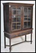 A good Victorian Jacobean commonwealth revival oak bookcase on stand. Raised on bobbin turned