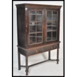 A good Victorian Jacobean commonwealth revival oak bookcase on stand. Raised on bobbin turned