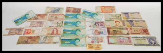 A collection of World banknotes paper money currency dating from the early 20th Century to include
