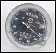 A Jaeger 80mph flanged speedometer having a black face with white hands. 9.5cm diameter.