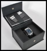 A contemporary Designer Hugo Boss tank style watch having blue dial with faceted hands and