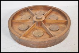 A decorative large oak bound cart wheel, the wheel ideal for coffee table conversion with solid