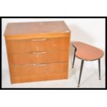 A retro 20th Century teak wood chest of three straight drawers together with a kidney shaped