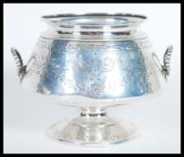 A 19th Century Victorian hallmarked silver two handled bowl by Martin and Hall raised on circular