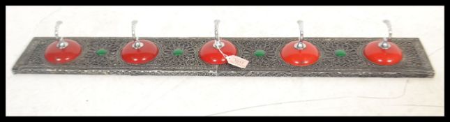 A 20th Century Moroccan coat hook having decorativ