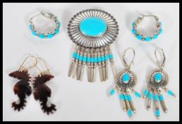 A collection of silver and turquoise stone jewellery to include a pair of hooped earrings set with