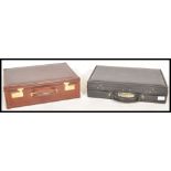 Two vintage leather suitcases to include a brown italian Casani business case with a