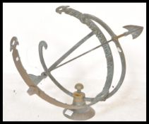 A vintage 20th century cast bronze  armillary sundial with central arrow and a Roman numeral chapter