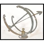 A vintage 20th century cast bronze  armillary sundial with central arrow and a Roman numeral chapter